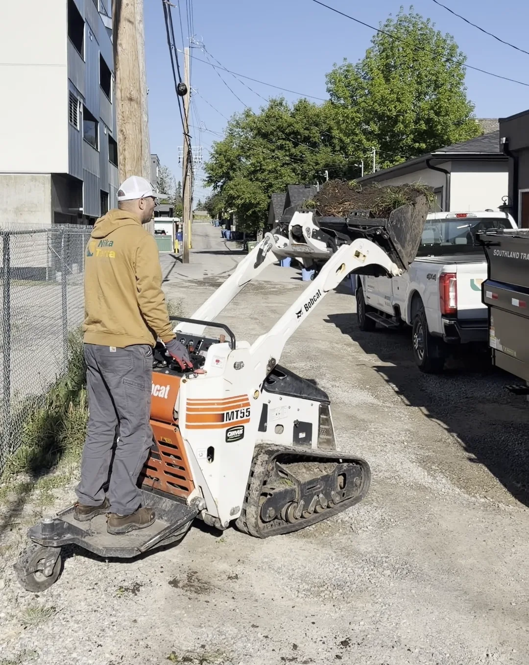Bobcat MT55 mini track loader used by Nika Terra for tight-access material handling in Calgary