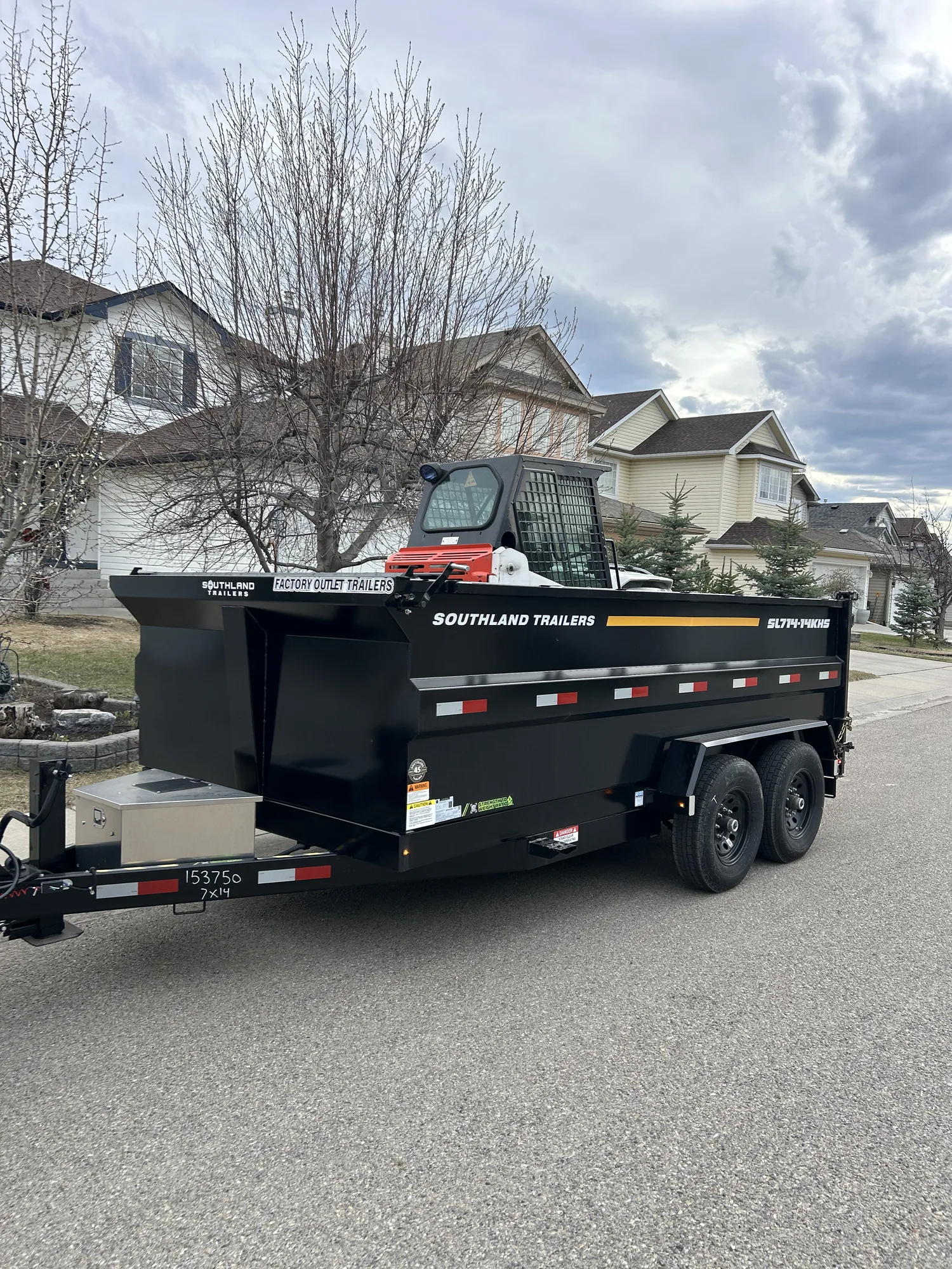 Dump trailer for debris removal and material haul-away in Calgary