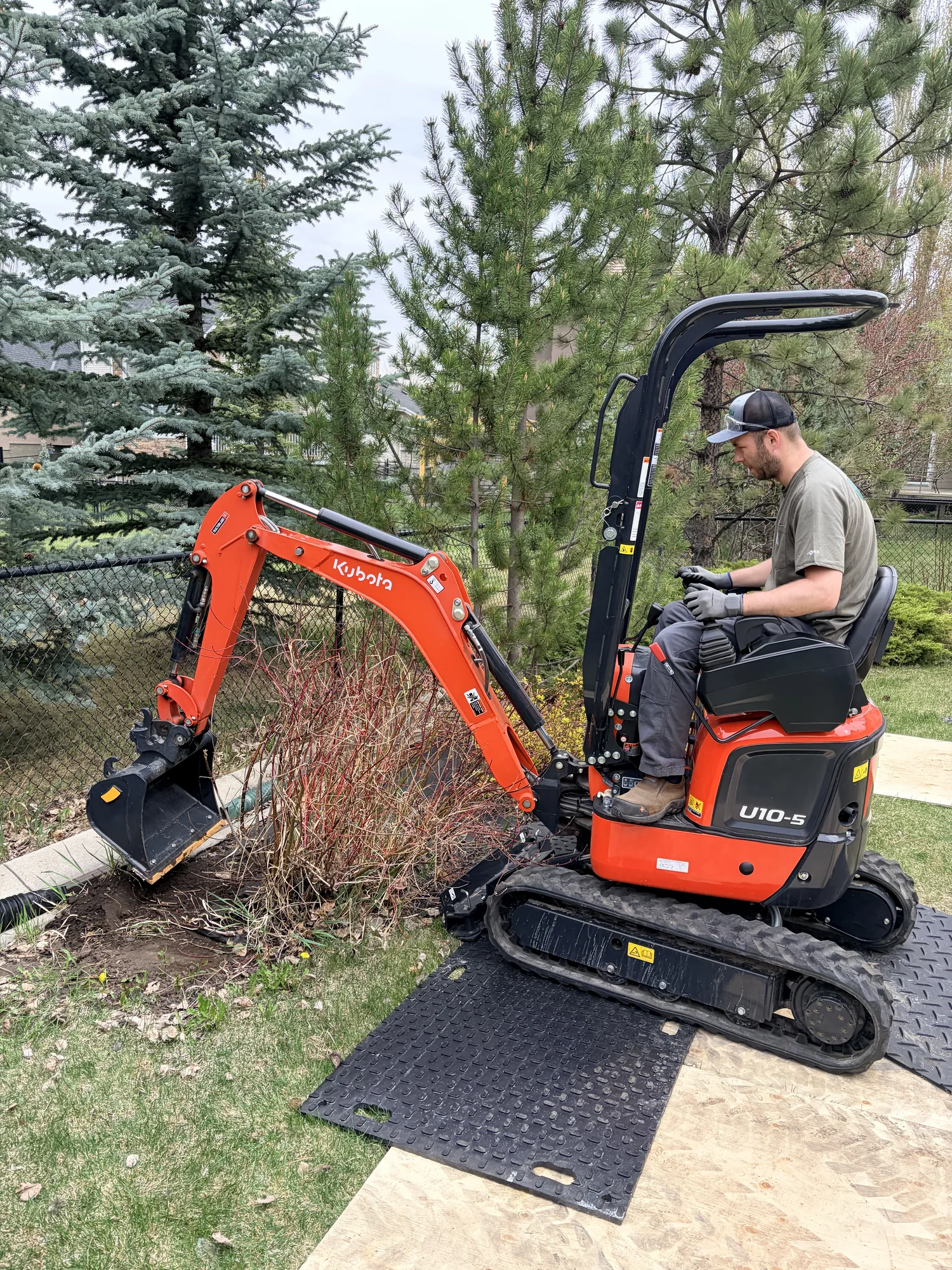 Mini excavator on a Calgary job site