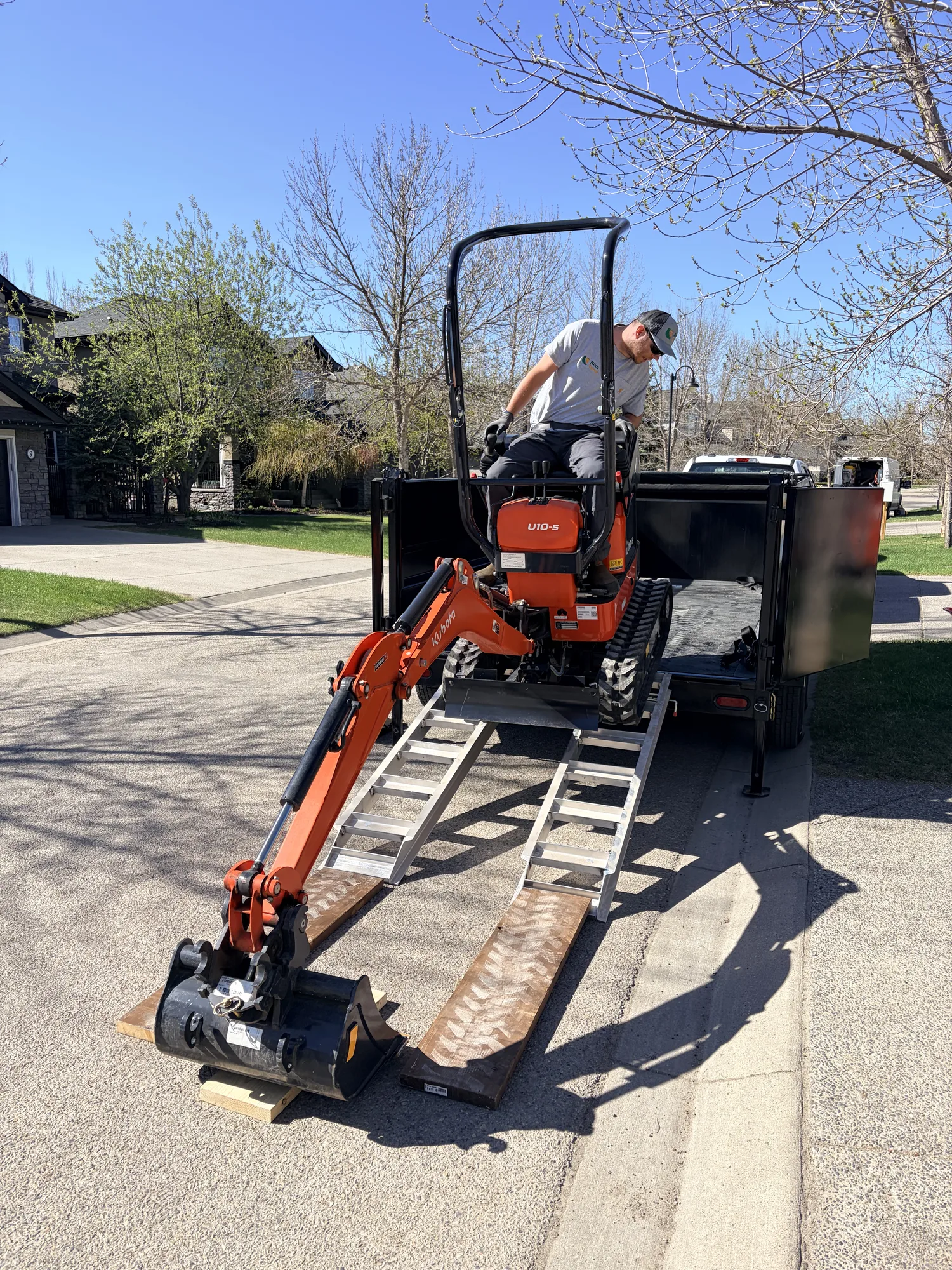 Compact track mini excavator used by Nika Terra for tight-access digging in Calgary