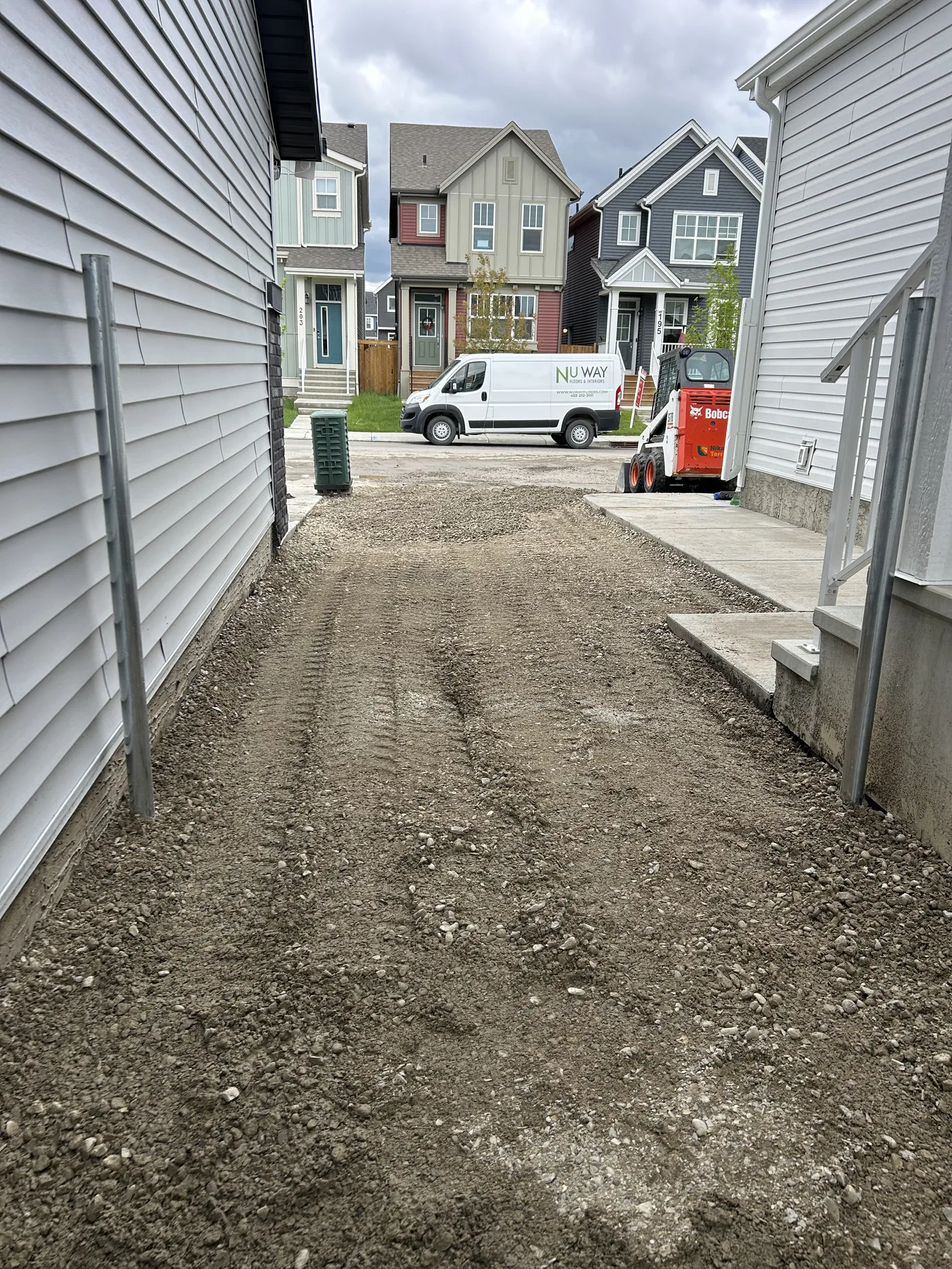 Crushed gravel placed across a graded Calgary backyard after yard preparation