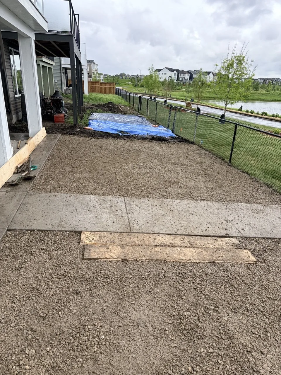 Finished Calgary backyard gravel area after grading and crushed gravel placement