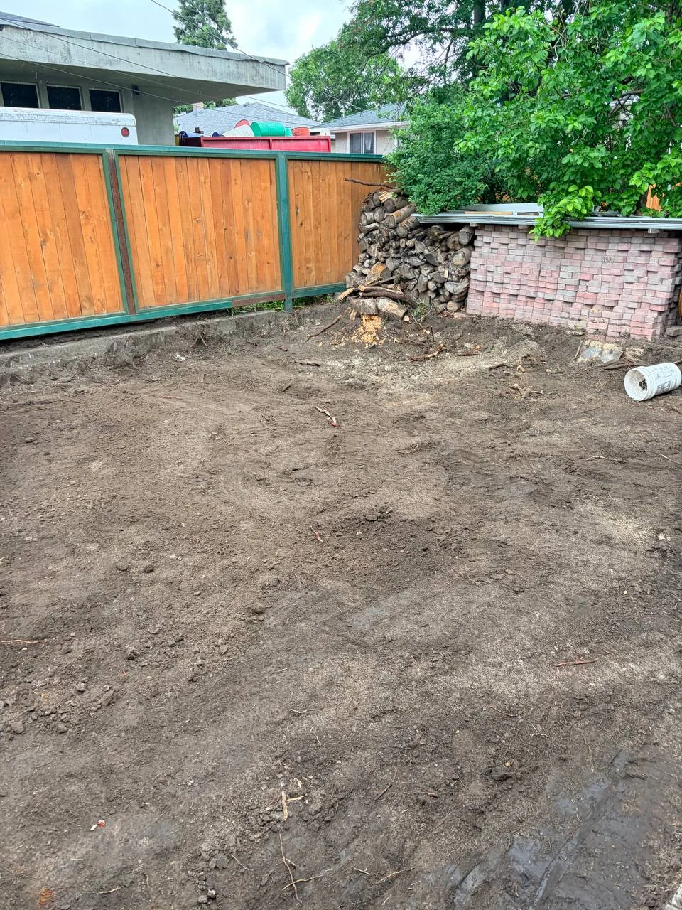Rough-leveled Calgary backyard after soil excavation and site preparation