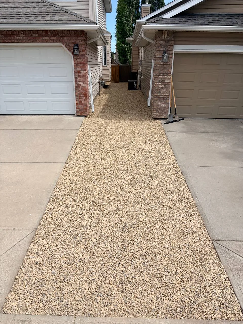 Finished Calgary landscape rock installation after weed barrier and leveling