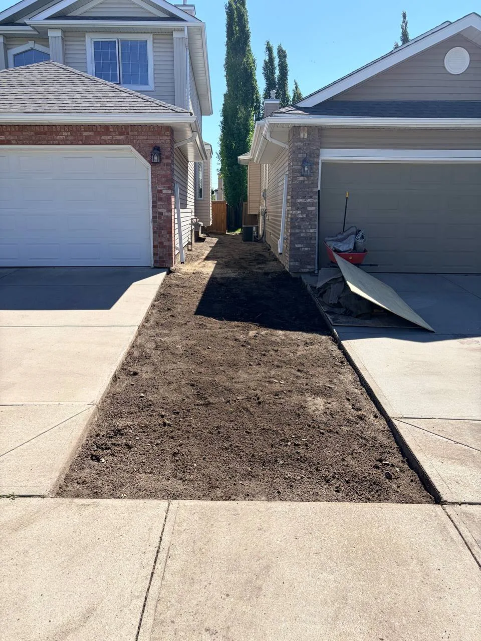 Calgary yard strip after sod and old gravel removal before weed barrier