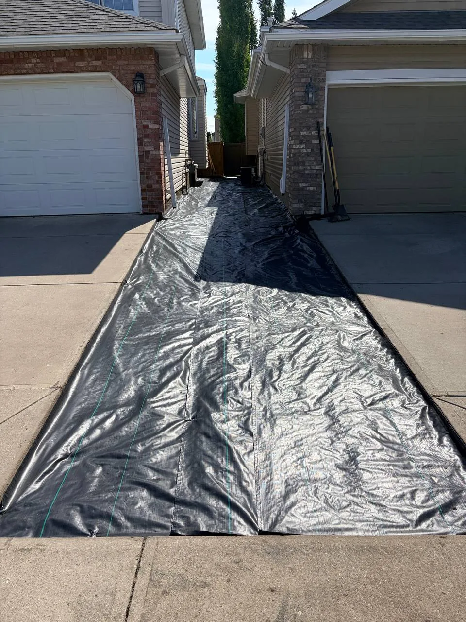 Weed barrier installed before decorative rock placement in Calgary