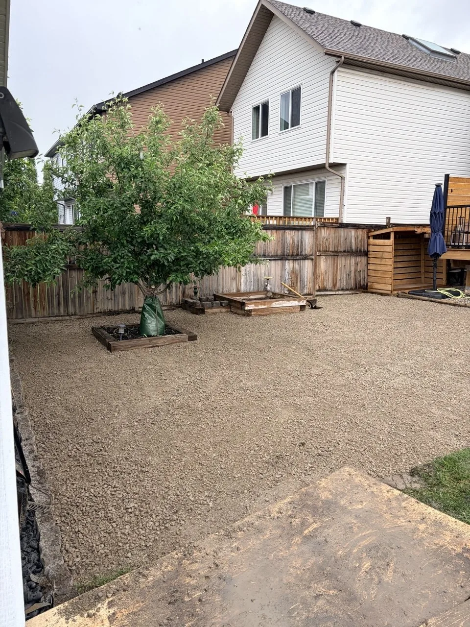Calgary backyard after compacted road crush base installation