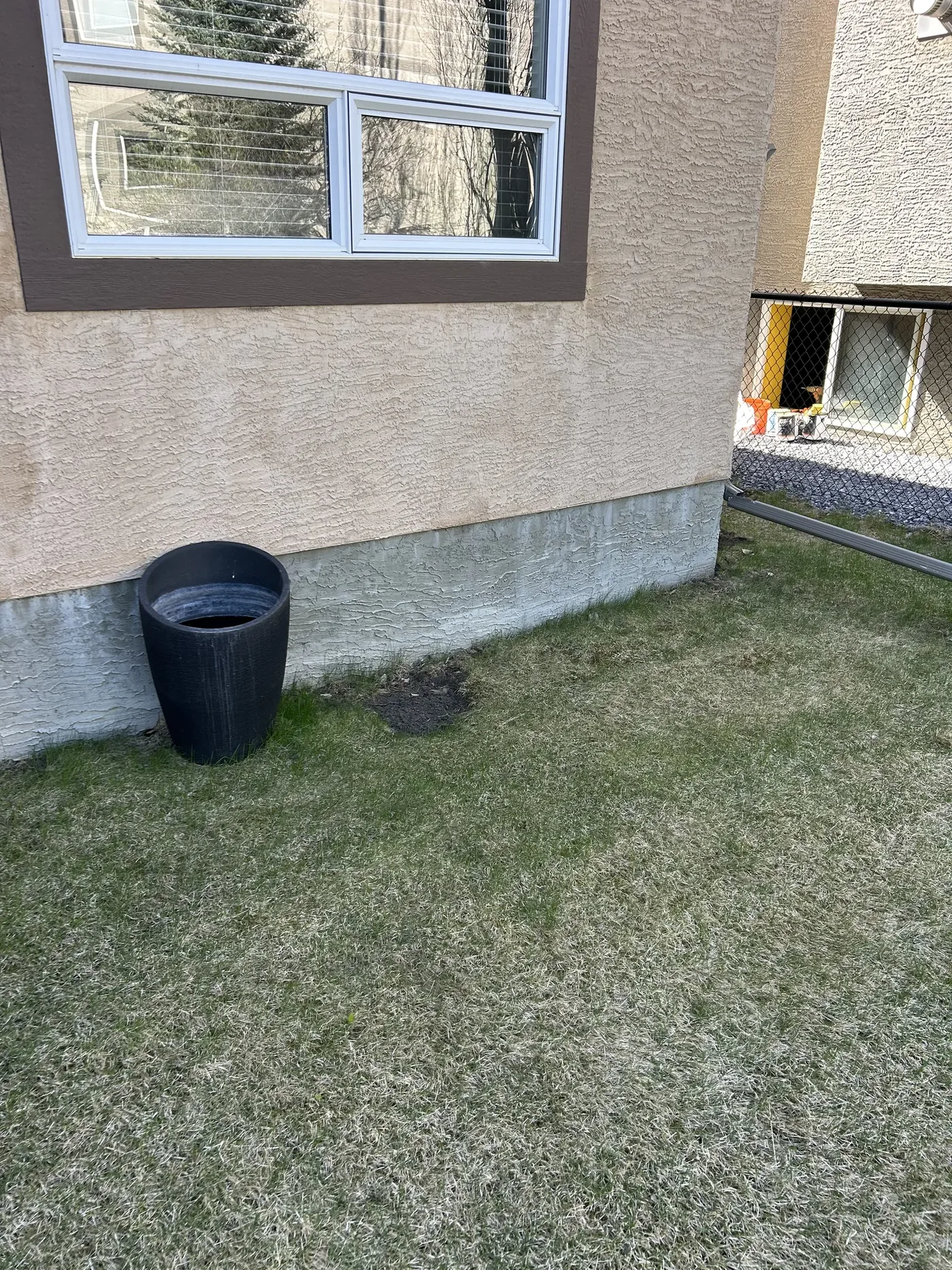 Backyard foundation edge before rock installation in Calgary