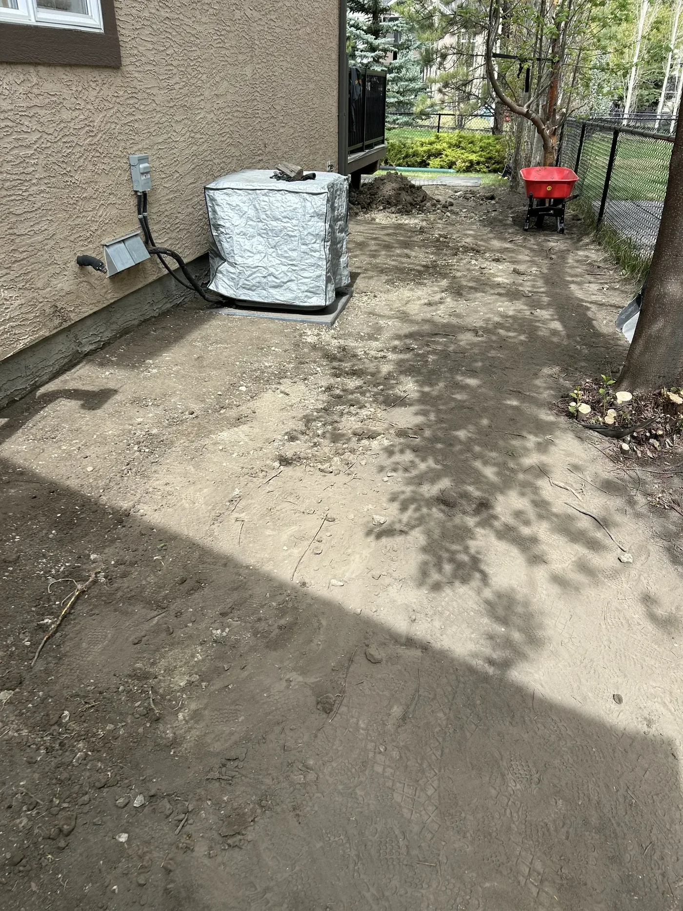 Calgary side yard after clay cap grading and base preparation