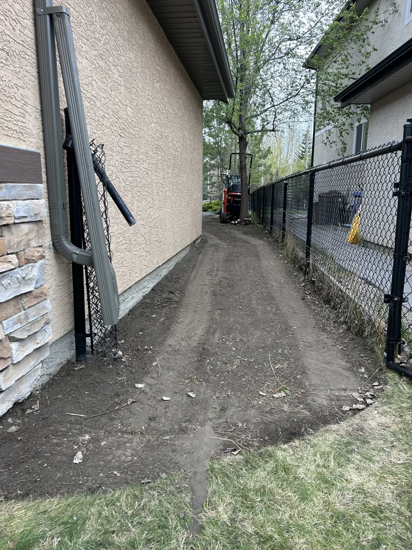 Front gate approach during limestone screening base preparation in Calgary
