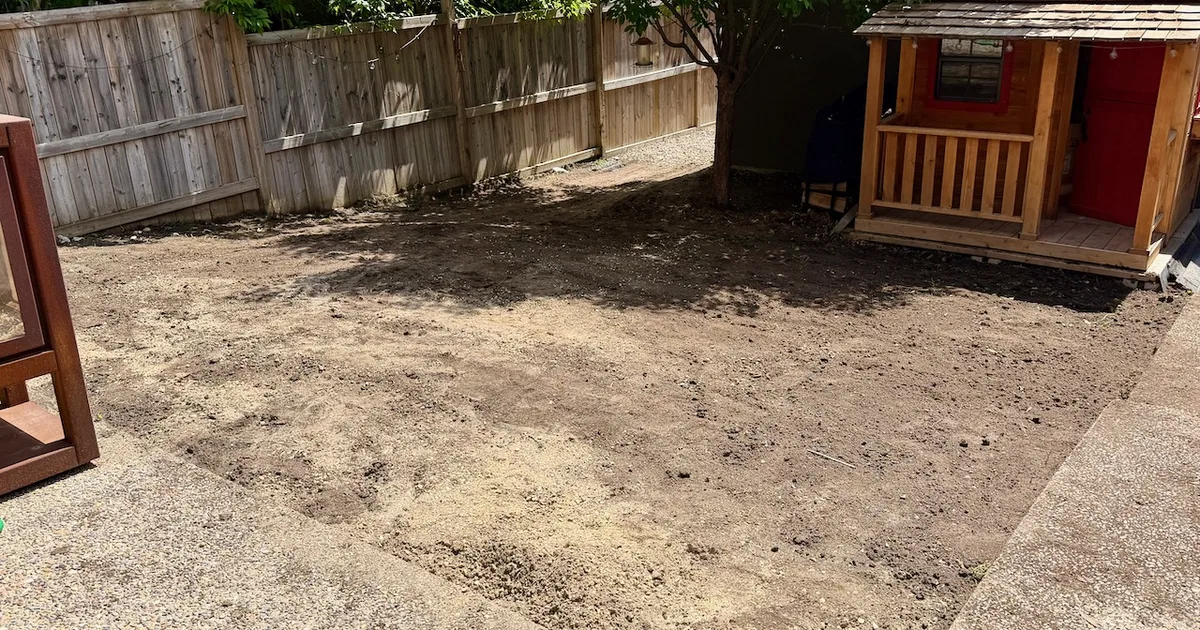Backyard sod and topsoil removal for landscaping site prep in Calgary